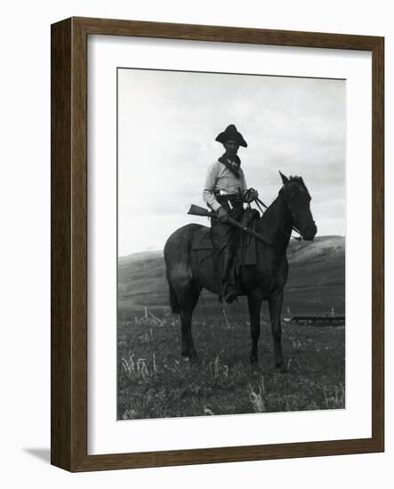 Cowboy on Horseback with Rifle-null-Framed Photographic Print