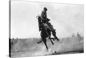 Cowboy riding Bronco in Burns, OR Rodeo Photograph - Burns, OR-Lantern Press-Stretched Canvas