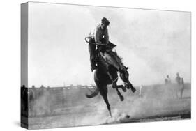 Cowboy riding Bronco in Burns, OR Rodeo Photograph - Burns, OR-Lantern Press-Stretched Canvas