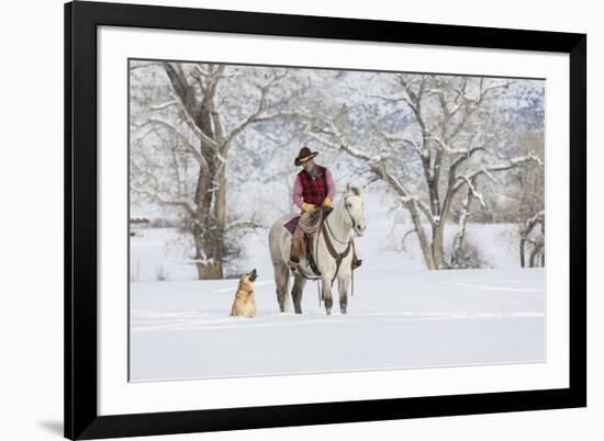 Cowboy riding his horse in winter, Hideout Ranch, Shell, Wyoming.-Darrell Gulin-Framed Photographic Print