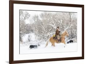 Cowboy riding his horse in winter, Hideout Ranch, Shell, Wyoming.-Darrell Gulin-Framed Photographic Print