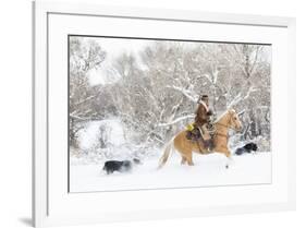 Cowboy riding his horse in winter, Hideout Ranch, Shell, Wyoming.-Darrell Gulin-Framed Photographic Print