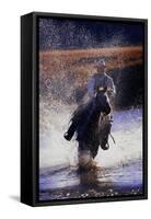 Cowboy Riding Horse Through River-Darrell Gulin-Framed Stretched Canvas