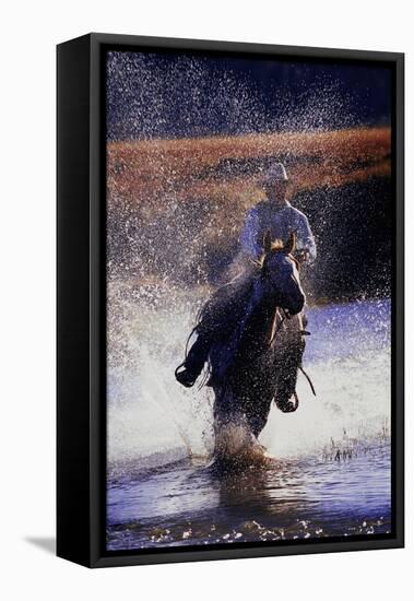 Cowboy Riding Horse Through River-Darrell Gulin-Framed Stretched Canvas