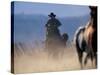 Cowboy Riding Horseback, Oregon, USA-William Sutton-Stretched Canvas