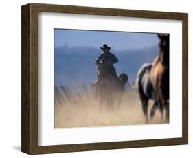 Cowboy Riding Horseback, Oregon, USA-William Sutton-Framed Photographic Print