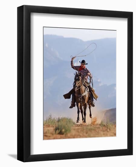 Cowboy Running with Rope Lassoo in Hand, Flitner Ranch, Shell, Wyoming, USA-Carol Walker-Framed Premium Photographic Print