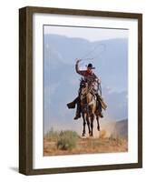 Cowboy Running with Rope Lassoo in Hand, Flitner Ranch, Shell, Wyoming, USA-Carol Walker-Framed Photographic Print