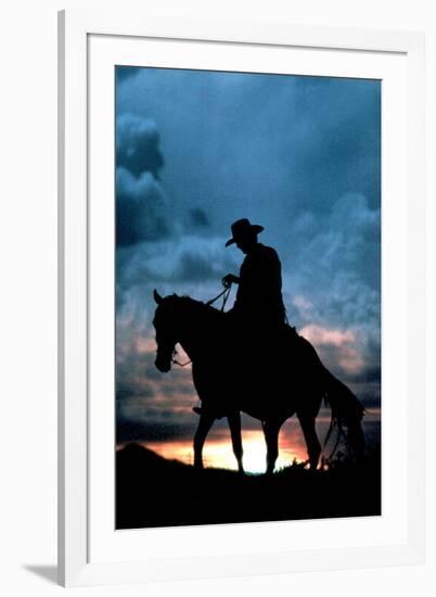 Cowboy Silhouette in Sunset-null-Framed Photo