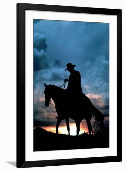 Cowboy Silhouette in Sunset-null-Framed Photo