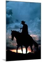 Cowboy Silhouette in Sunset-null-Mounted Photo