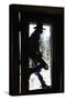 Cowboy Silhouetted in Door Frame-null-Stretched Canvas
