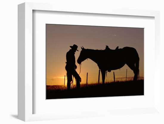 Cowboy Standing with His Horse-Darrell Gulin-Framed Photographic Print