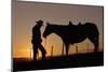 Cowboy Standing with His Horse-Darrell Gulin-Mounted Photographic Print