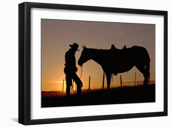 Cowboy Standing with His Horse-Darrell Gulin-Framed Photographic Print