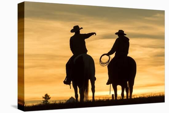 Cowboys and Horses in Silhouette at Dawn on Ranch, British Colombia, Canada-Peter Adams-Stretched Canvas