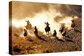 Cowboys Chasing Wilding Horses. Roping and Riding, with Dust Flying Everywhere-Jeanne Provost-Stretched Canvas