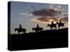 Cowboys in Silhouette with Sunset-Terry Eggers-Stretched Canvas