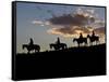 Cowboys in Silhouette with Sunset-Terry Eggers-Framed Stretched Canvas