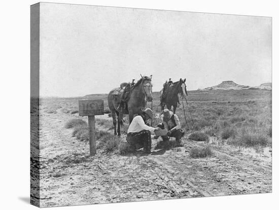 Cowboys Reading the News Near a Postbox Photograph - Texas-Lantern Press-Stretched Canvas