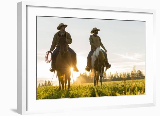 Cowboys Riding across Grassland with Moutains Behind, Early Morning, British Colombia, B.C., Canada-Peter Adams-Framed Photographic Print