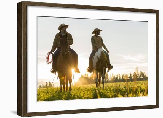 Cowboys Riding across Grassland with Moutains Behind, Early Morning, British Colombia, B.C., Canada-Peter Adams-Framed Photographic Print