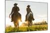 Cowboys Riding across Grassland with Moutains Behind, Early Morning, British Colombia, B.C., Canada-Peter Adams-Mounted Photographic Print