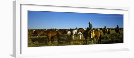 Cowboys Riding Horses in a Field-null-Framed Photographic Print