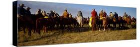 Cowboys Riding Horses in a Field-null-Stretched Canvas