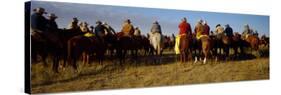 Cowboys Riding Horses in a Field-null-Stretched Canvas