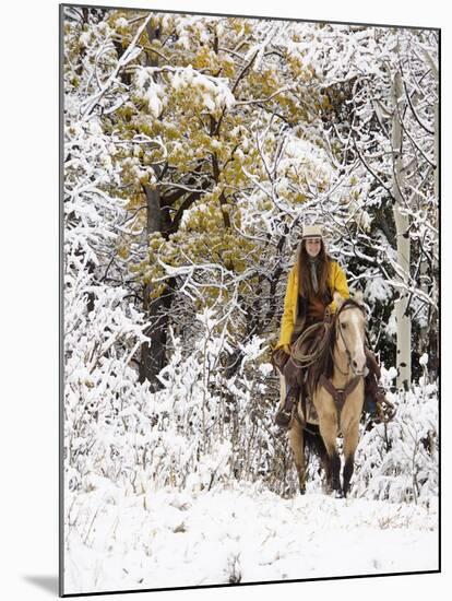 Cowgirl Riding in Autumn Aspens with a Fresh Snowfall-Terry Eggers-Mounted Photographic Print