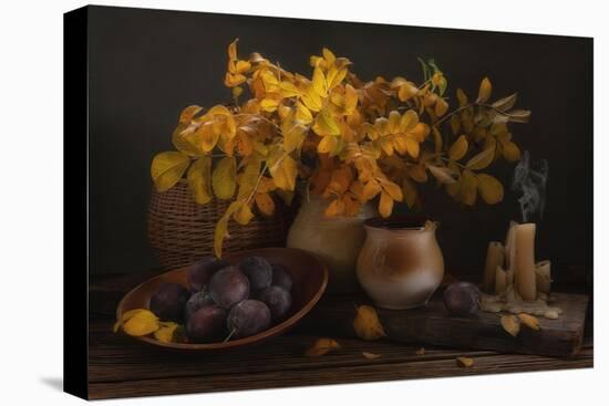 Cozy Autumn Still Life with Yellow Leaves, Plumes and Candles on Wooden Table-Eleonora Grigorjeva-Stretched Canvas