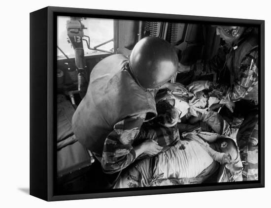 Cpl. James Farley and Pfc. Wayne Hoilien Bandaging Sgt. Billie Owens' Shoulder, Yankee Papa 13-Larry Burrows-Framed Stretched Canvas