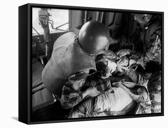 Cpl. James Farley and Pfc. Wayne Hoilien Bandaging Sgt. Billie Owens' Shoulder, Yankee Papa 13-Larry Burrows-Framed Stretched Canvas