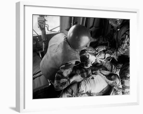 Cpl. James Farley and Pfc. Wayne Hoilien Bandaging Sgt. Billie Owens' Shoulder, Yankee Papa 13-Larry Burrows-Framed Photographic Print