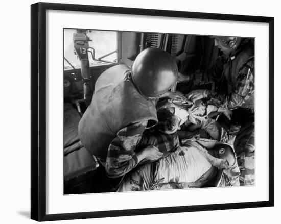 Cpl. James Farley and Pfc. Wayne Hoilien Bandaging Sgt. Billie Owens' Shoulder, Yankee Papa 13-Larry Burrows-Framed Photographic Print