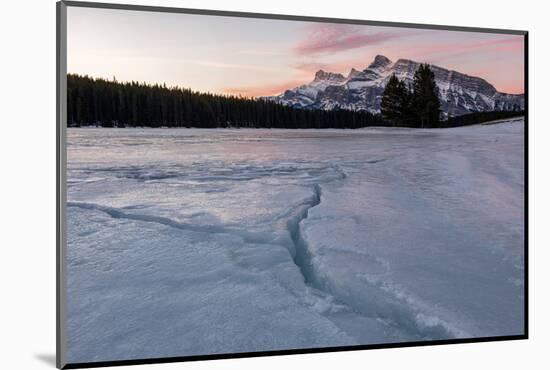 Cracks in ice on frozen lake at sunrise, Mount Rundle, Banff National Park, Alberta, Canada-null-Mounted Photographic Print