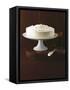 Cream Layer Cake on a Cake Stand Next to a Pot of Cinnamon Sticks - Conde Nast Collection-null-Framed Stretched Canvas