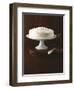 Cream Layer Cake on a Cake Stand Next to a Pot of Cinnamon Sticks - Conde Nast Collection-null-Framed Photographic Print