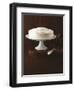 Cream Layer Cake on a Cake Stand Next to a Pot of Cinnamon Sticks - Conde Nast Collection-null-Framed Photographic Print