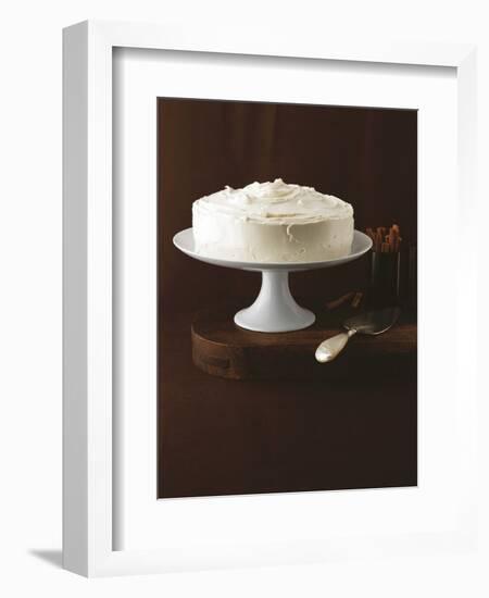 Cream Layer Cake on a Cake Stand Next to a Pot of Cinnamon Sticks - Conde Nast Collection-null-Framed Photographic Print