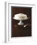 Cream Layer Cake on a Cake Stand Next to a Pot of Cinnamon Sticks - Conde Nast Collection-null-Framed Photographic Print