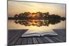 Creative Concept Image of Refelcted Lake Sunset Coming out of Pages in Magical Book-Veneratio-Mounted Photographic Print