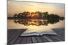 Creative Concept Image of Refelcted Lake Sunset Coming out of Pages in Magical Book-Veneratio-Mounted Photographic Print