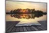 Creative Concept Image of Refelcted Lake Sunset Coming out of Pages in Magical Book-Veneratio-Mounted Photographic Print