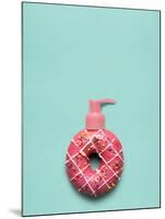 Creative Still Life of a Tasty Sweet Donut with a Cosmetic Pump Dispenser on Blue Background-Fisher Photostudio-Mounted Photographic Print