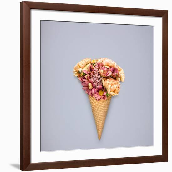 Creative Still Life of an Ice Cream Waffle Cone with Flowers on Grey Background-Fisher Photostudio-Framed Photographic Print