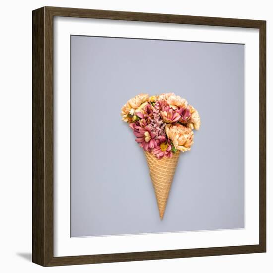 Creative Still Life of an Ice Cream Waffle Cone with Flowers on Grey Background-Fisher Photostudio-Framed Photographic Print