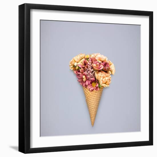 Creative Still Life of an Ice Cream Waffle Cone with Flowers on Grey Background-Fisher Photostudio-Framed Photographic Print