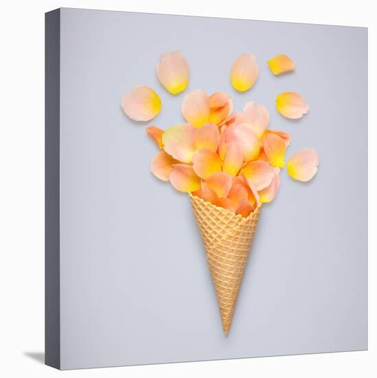 Creative Still Life of an Ice Cream Waffle Cone with Rose Petals on Grey-Fisher Photostudio-Stretched Canvas